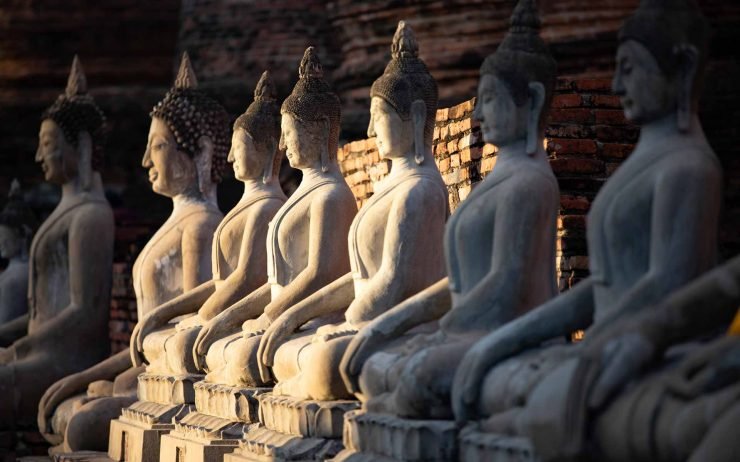 sitting-buddha-statues-at-wat-yai-chai-mongkhon-GTD695P.jpg
